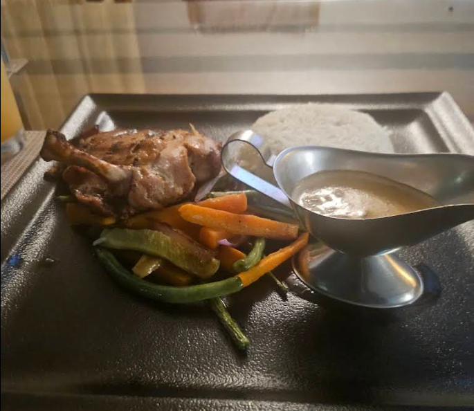 Lilian Tower Cafe plated meal with vegetables, rice, and sauce